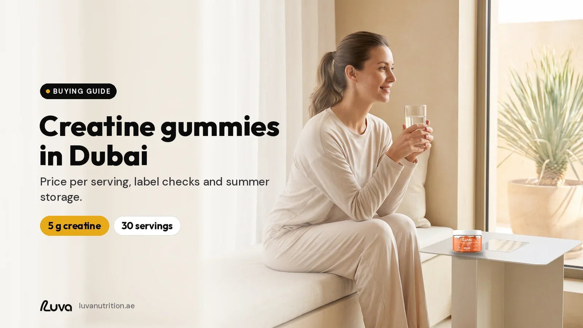 LUVA Creatine Gummies raspberry tin on a side table with a woman holding water in a Dubai apartment