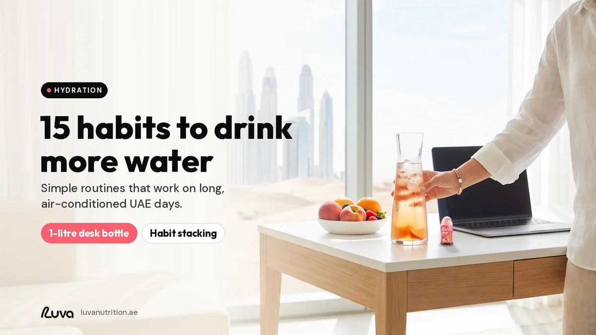 How to drink more water: 1-litre bottle of peach iced tea flavoured water on an office desk with a Dubai view, with a LUVA ZERUP Peach Iced Tea sugar-free syrup bottle