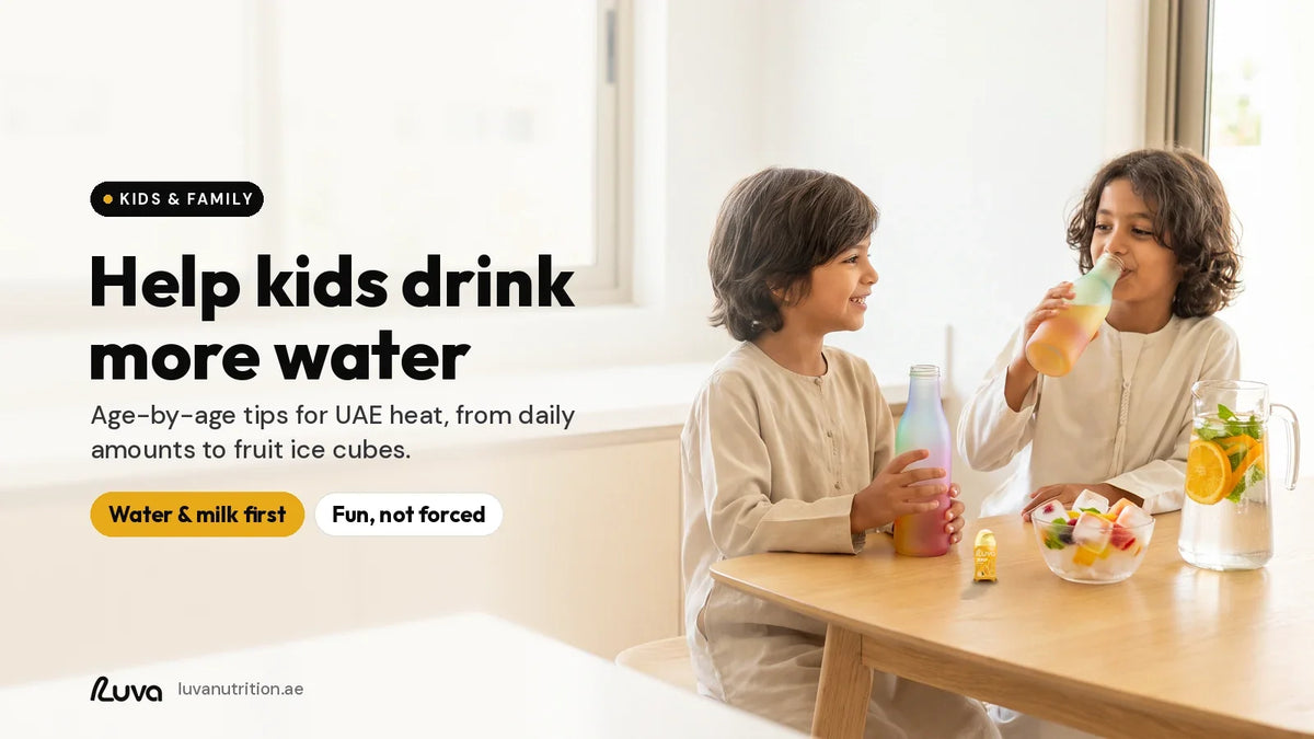 Helping kids drink more water: two children drinking from colourful bottles at a sunny family kitchen table, with a LUVA ZERUP Orange sugar-free syrup bottle